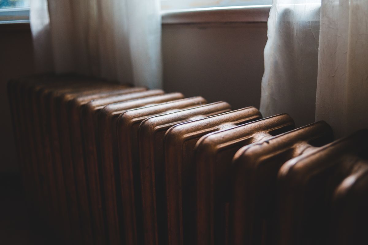 Domestic radiator beside a window